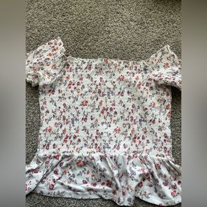 A beautiful flowery worn once shirt